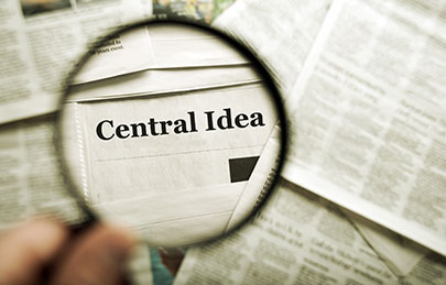 magnifying lens over term central idea