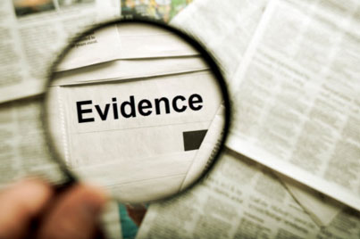 magnifying glass showing the word evidence