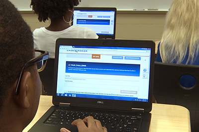 – image of students looking at casemaker on laptops