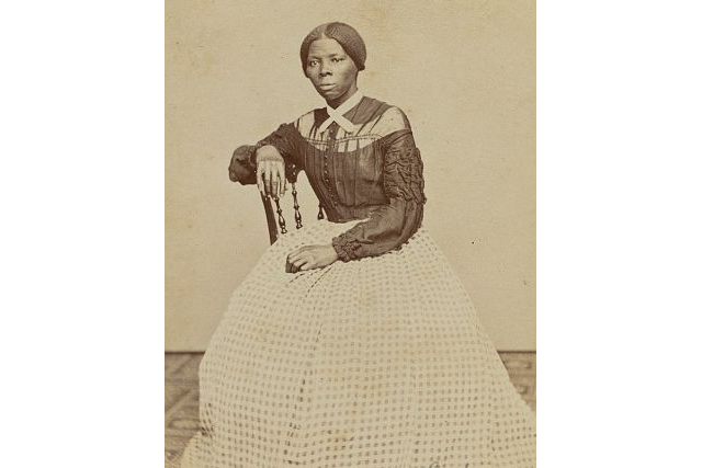 black and white photo of a young Harriet Tubman sitting in a chair